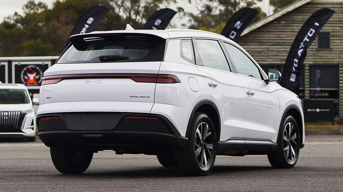 Rear shot of white BYD Sealion 5 SUV in front of chalet at Lang Lang proving ground in Victoria during BYD Drive Experience Day.