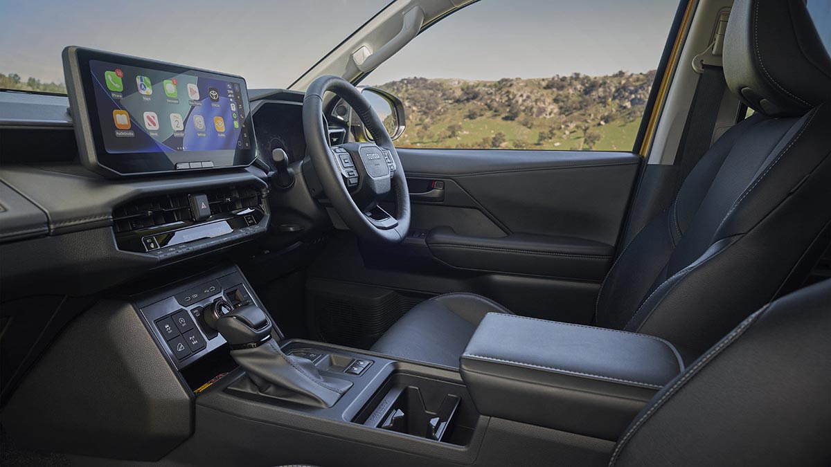 Interior of high-series Toyota HiLux with three-tiered dash and 12.3-inch centre touchscreen.