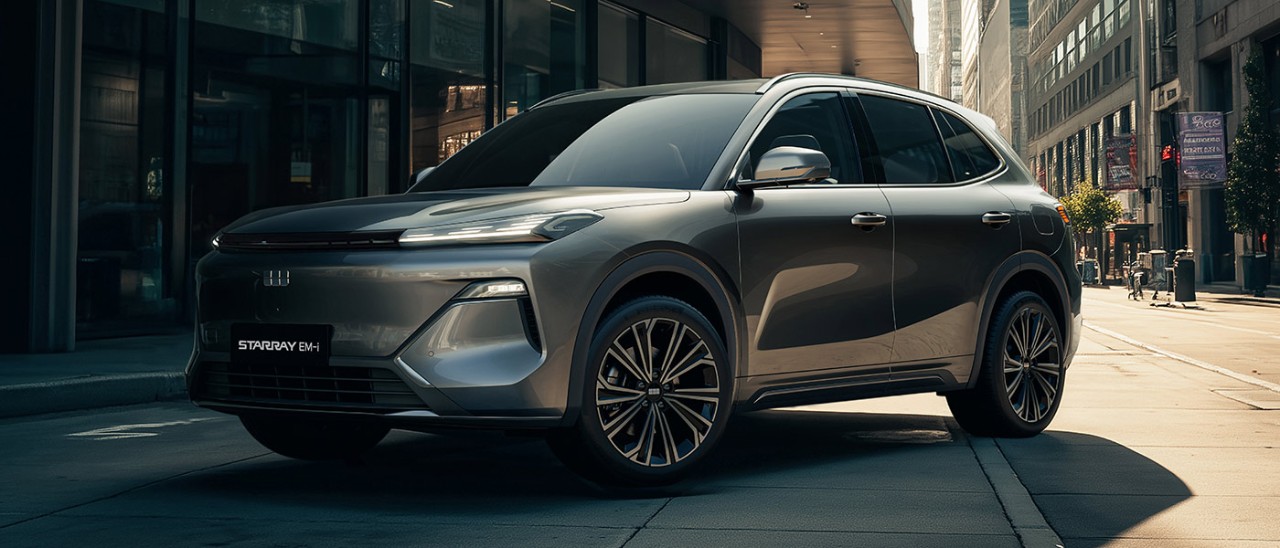 Silver Geely Starray EM-i plug-in hybrid medium SUV parked on side of city street