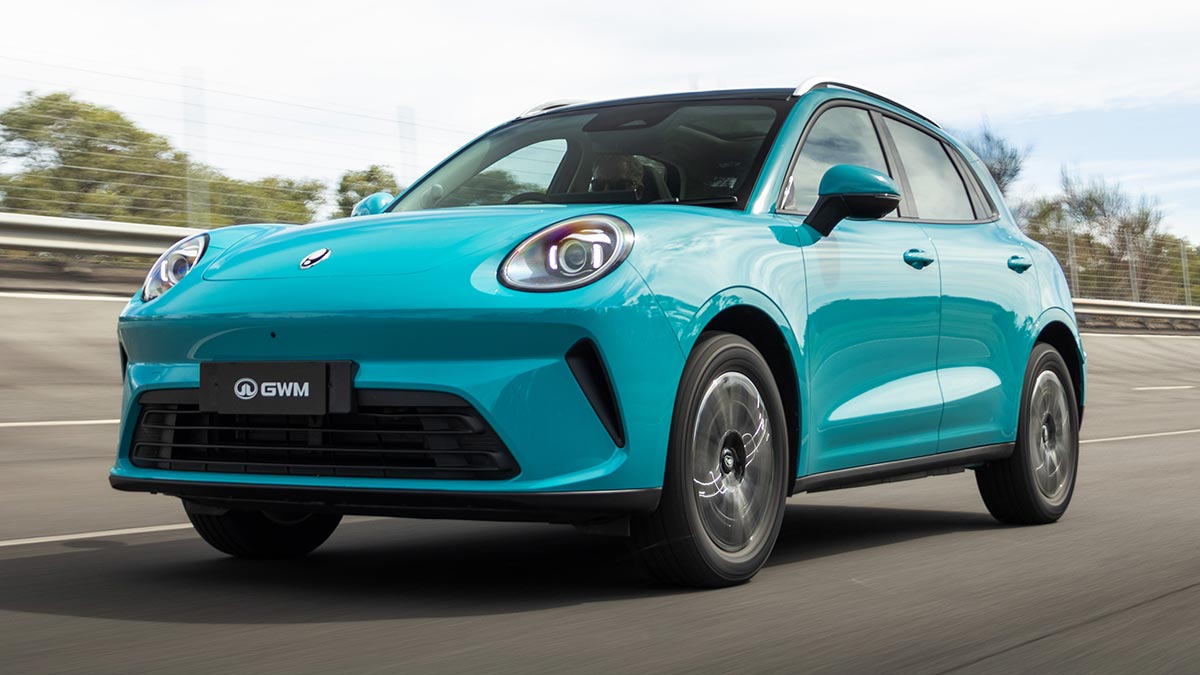Front quarter shot of duck-egg blue GWM Ora 5 electric small SUV on high-speed bowl at Lang Lang proving ground in Victoria.