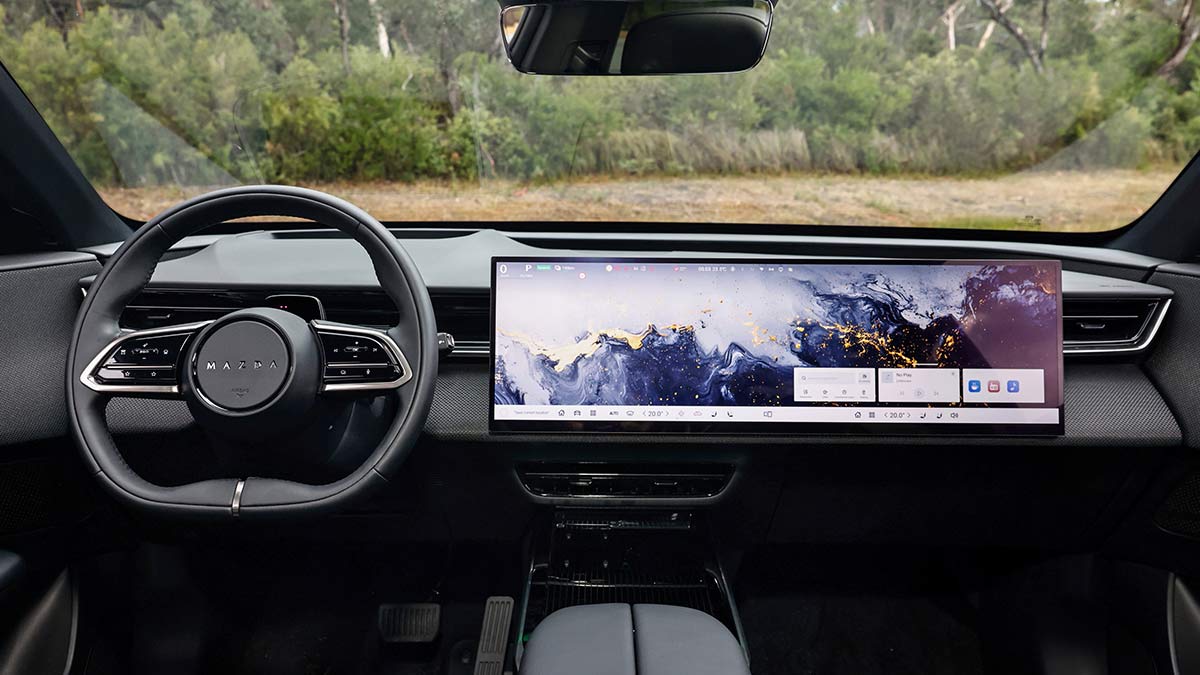 Dashboard of Mazda CX-6e SUV with giant 26-inch centre touchscreen taking up a lot of space.