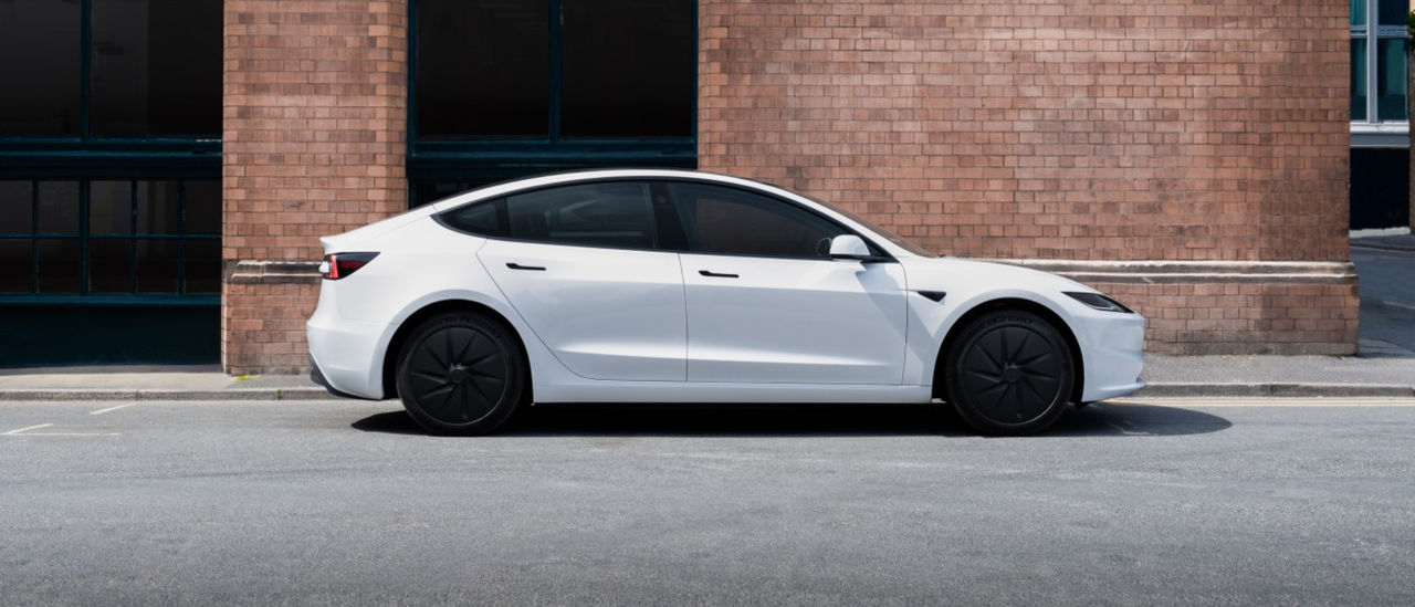 white 2026 Tesla Model 3 parked outside
