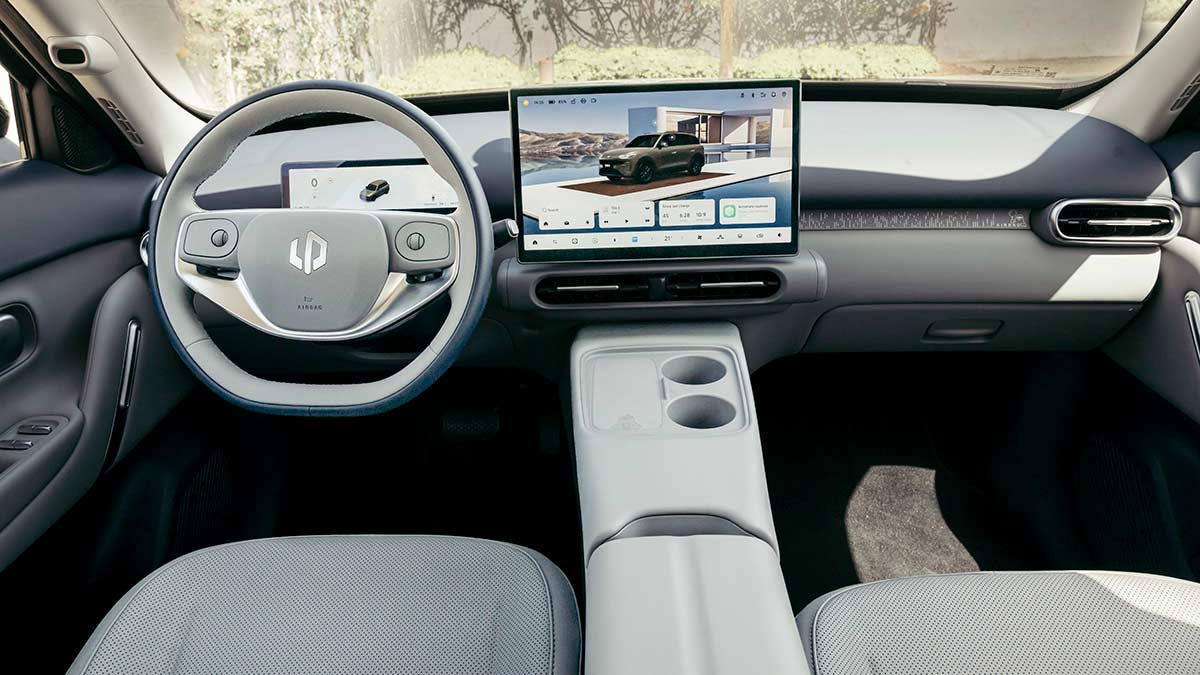 Dashboard area of Leapmotor B03X small SUV with light grey seat trim, plum dash colour, dual digital screens and minimalist design.