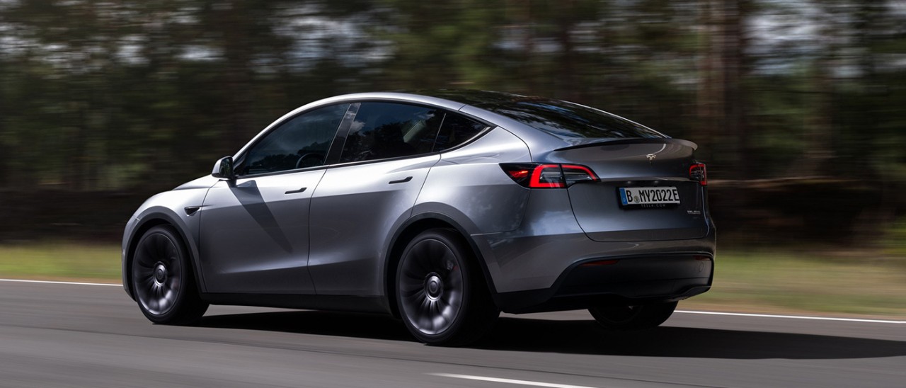 Tesla-ModelY-03-banner.jpg Tesla Model Y being driven on country road