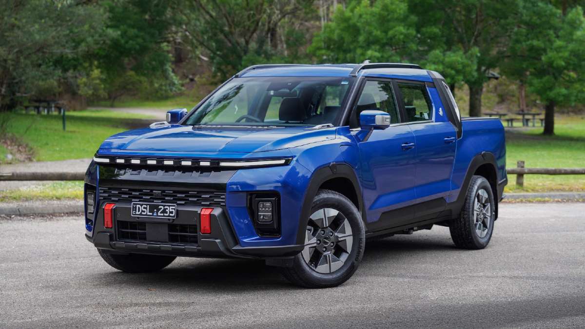 dark blue 2026 KGM Musso EV parked on road