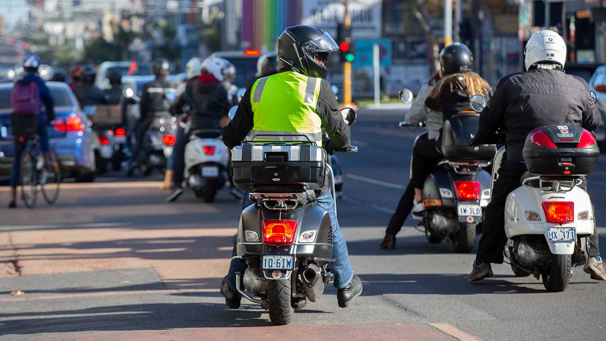 Motorcyclist with high-visibility vest