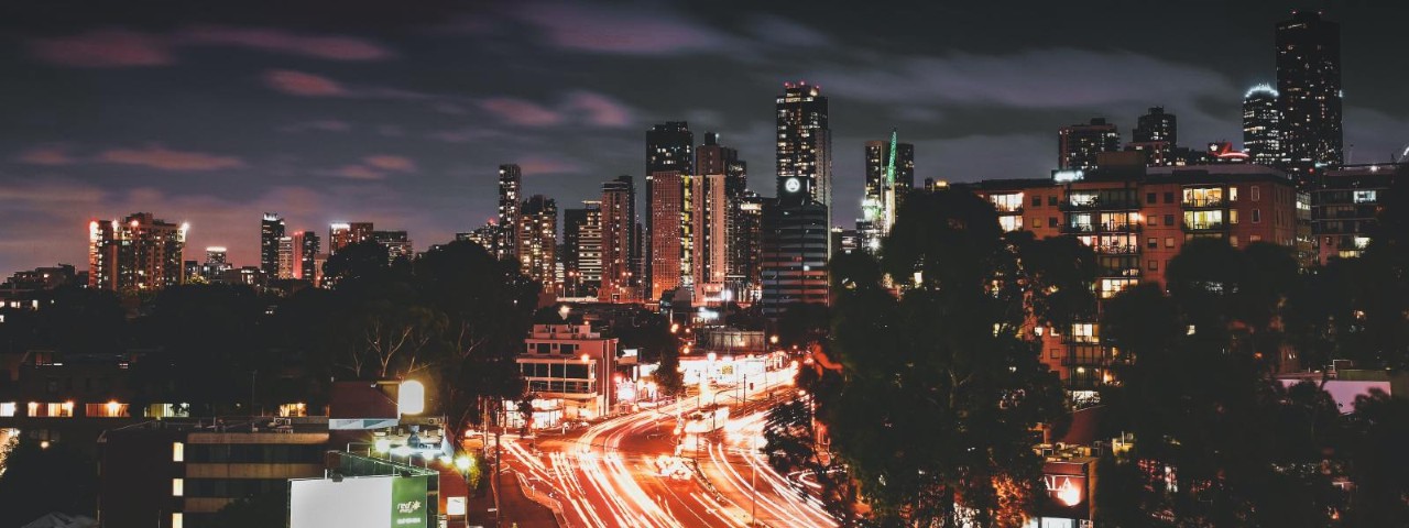 melbourne street and city skyline at sunset