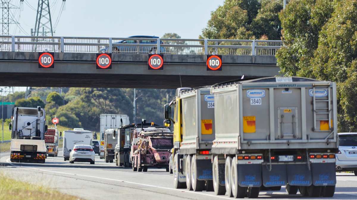 Variable speed limit signs overhead on a freeway