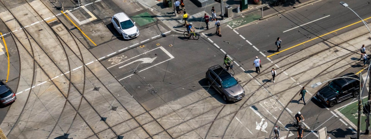 1309015751 A busy CBD intersection with complex road directions in Melbourne.