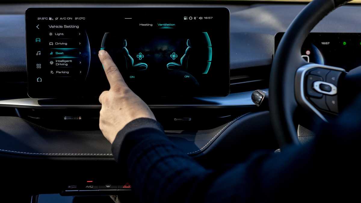 person operating infotainment screen in Haval H6