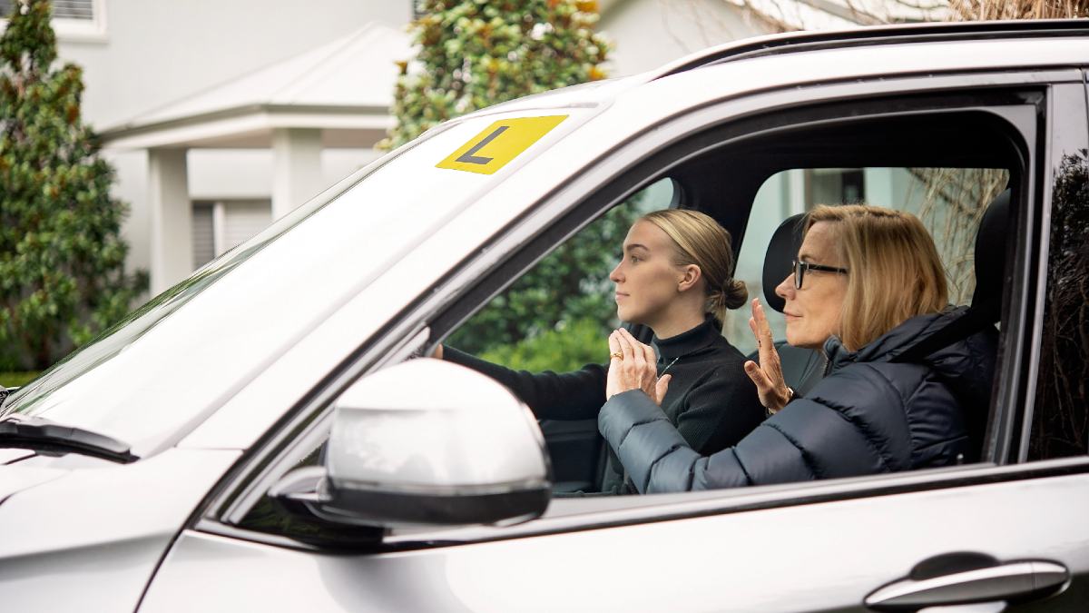 learner driver with mother in car