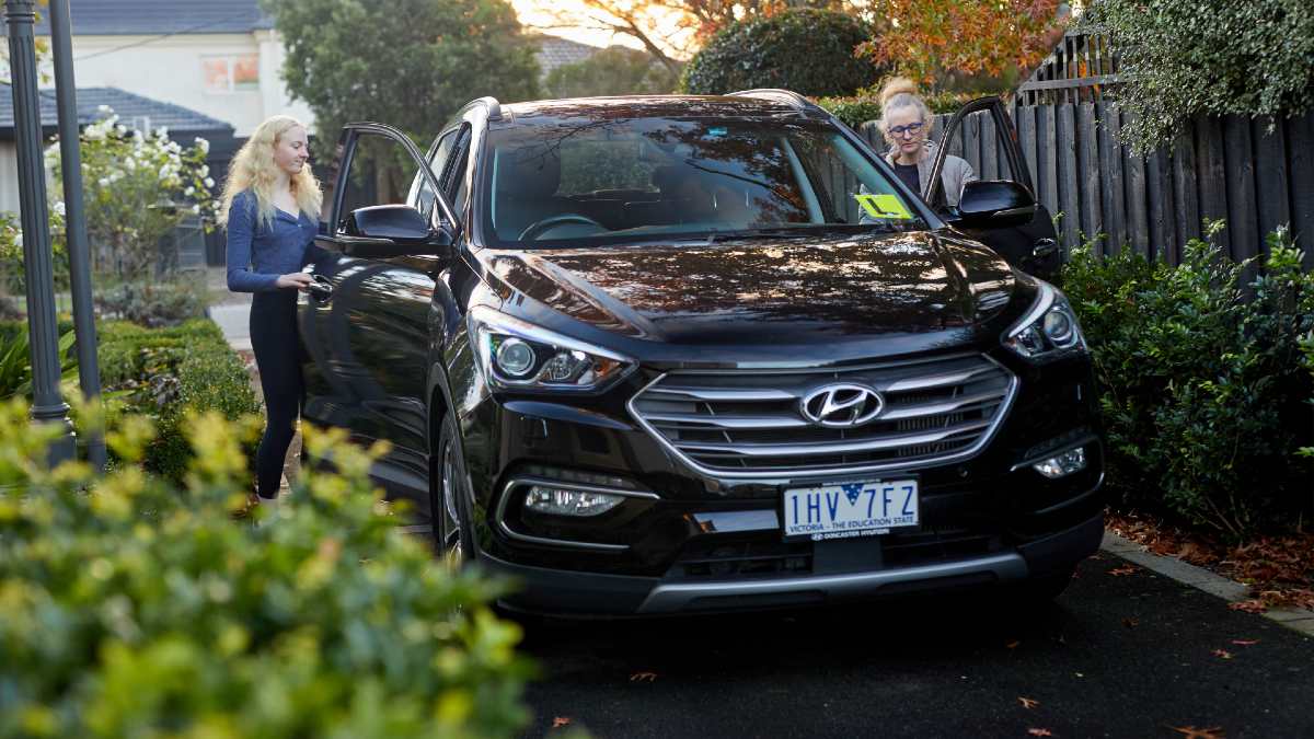 learner driver getting into car with mother