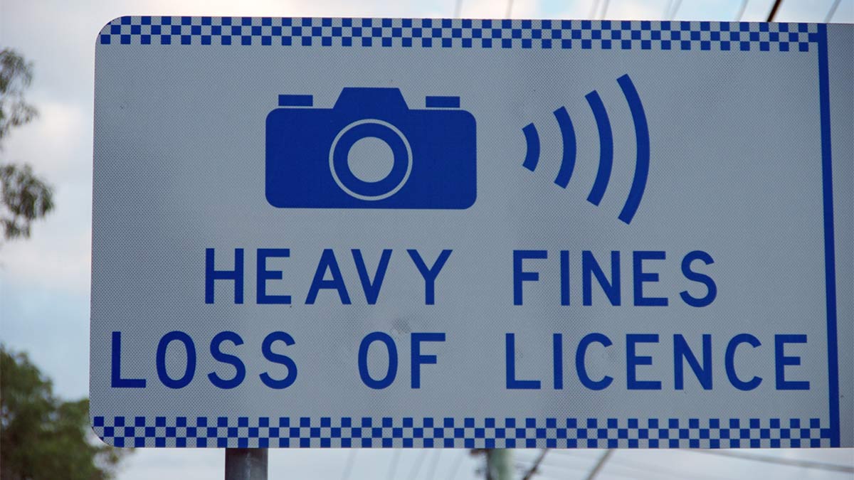 A road sign that says 'heavy fines loss of licence'