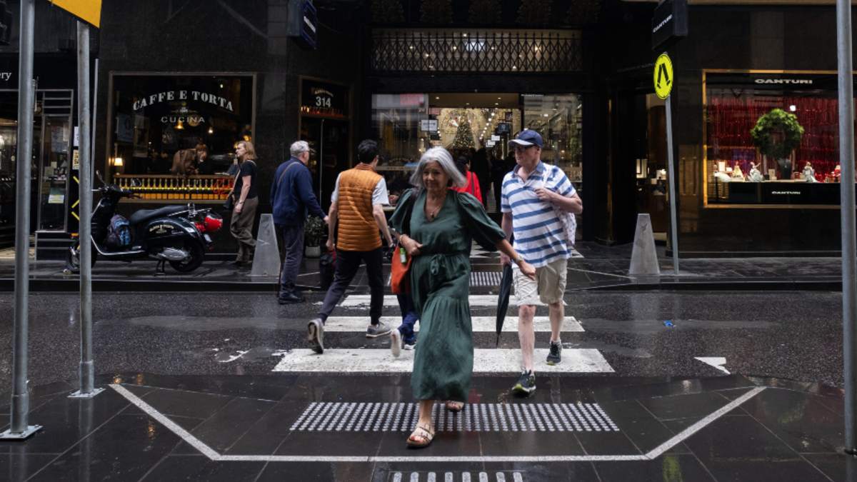Pedestrians crossing the road in Melbourne's laneways
