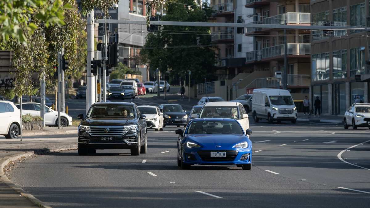 multiple cars driving on inner city Melbourne road