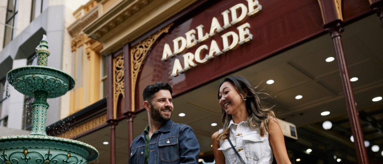 woman and man exiting Adelaide Arcade