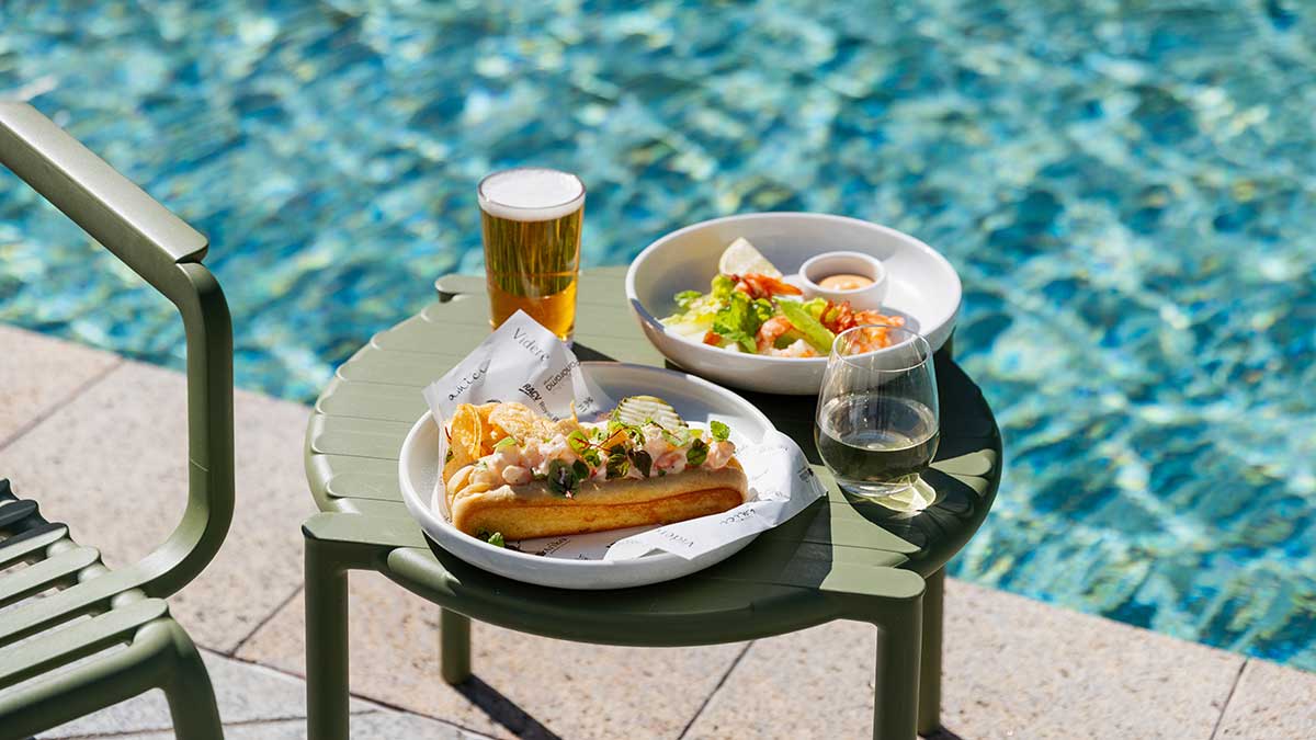 Food on table next to pool at resort.