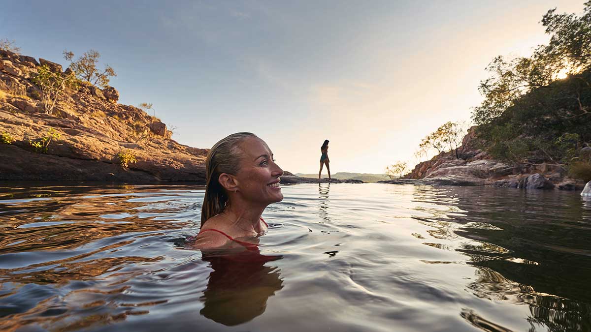 Woman swimming at Gunlom Falls, Kakadu
