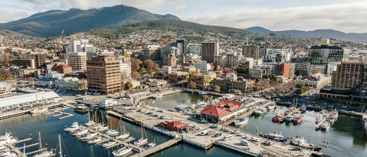 aerial view of Hobart waterfront and city with mountain behind