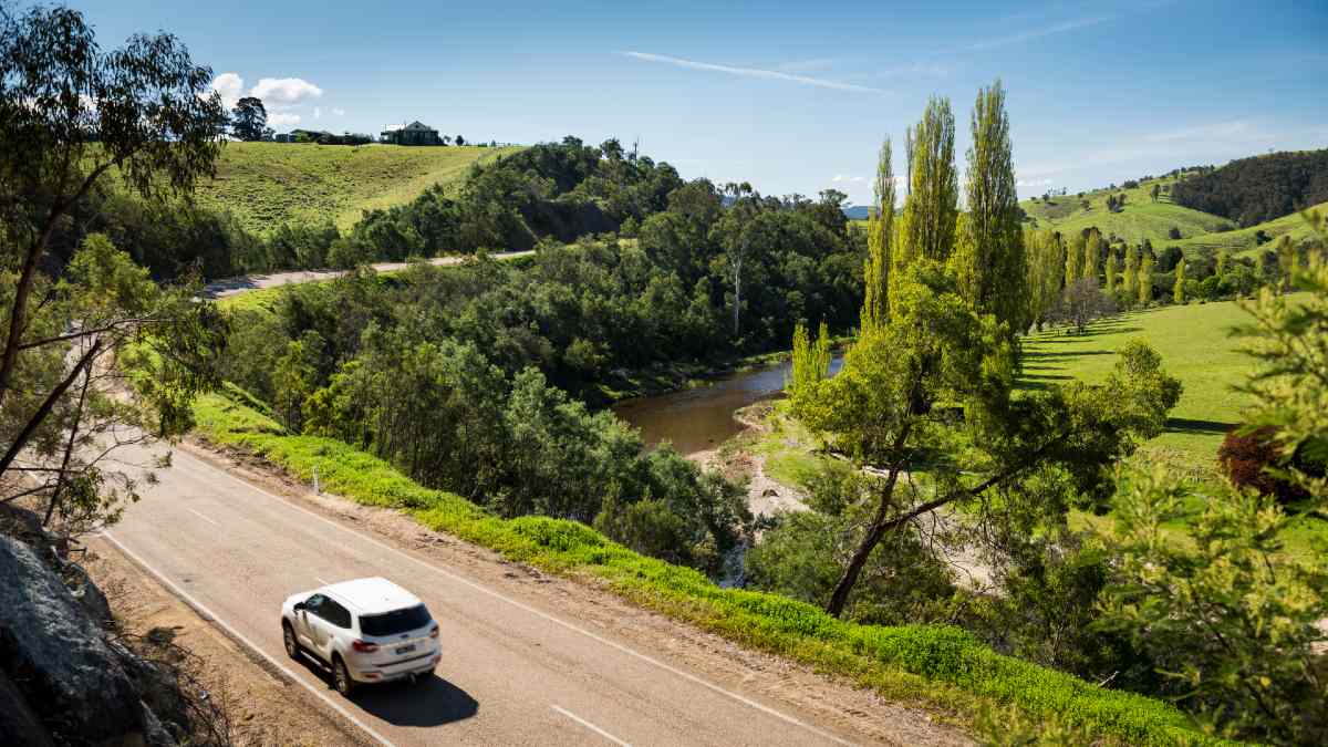 white car driving along the Great Alpine Road