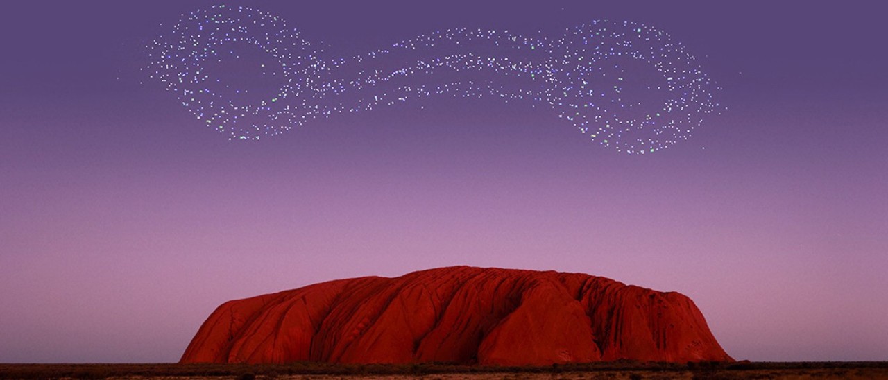 Uluru_Voyages Indigenous Tourims Australia Uluru at sunset with a drone show in the sky