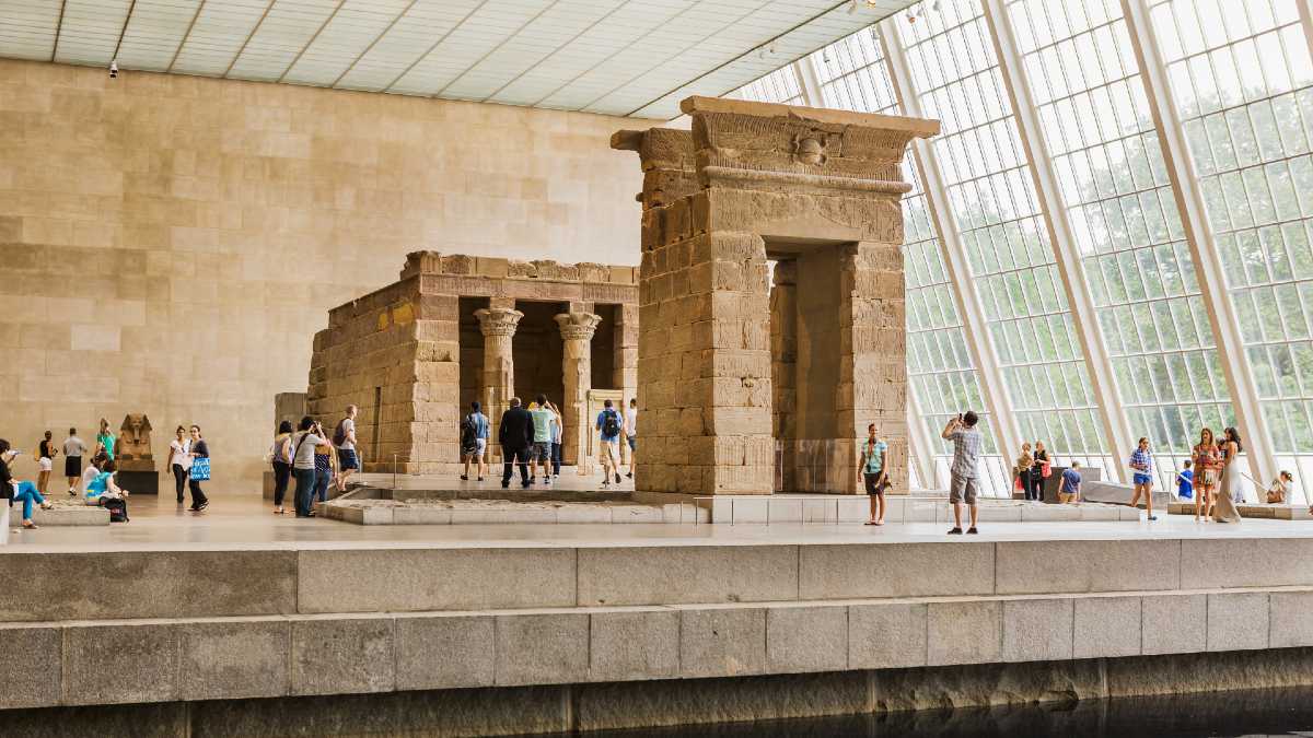 people walking around a museum exhibit