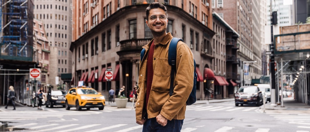 man standing smiling in NYC