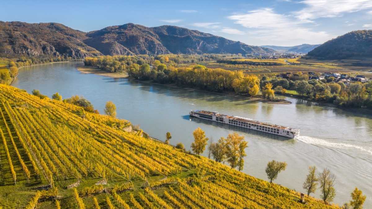 river cruise ship on an European countryside river