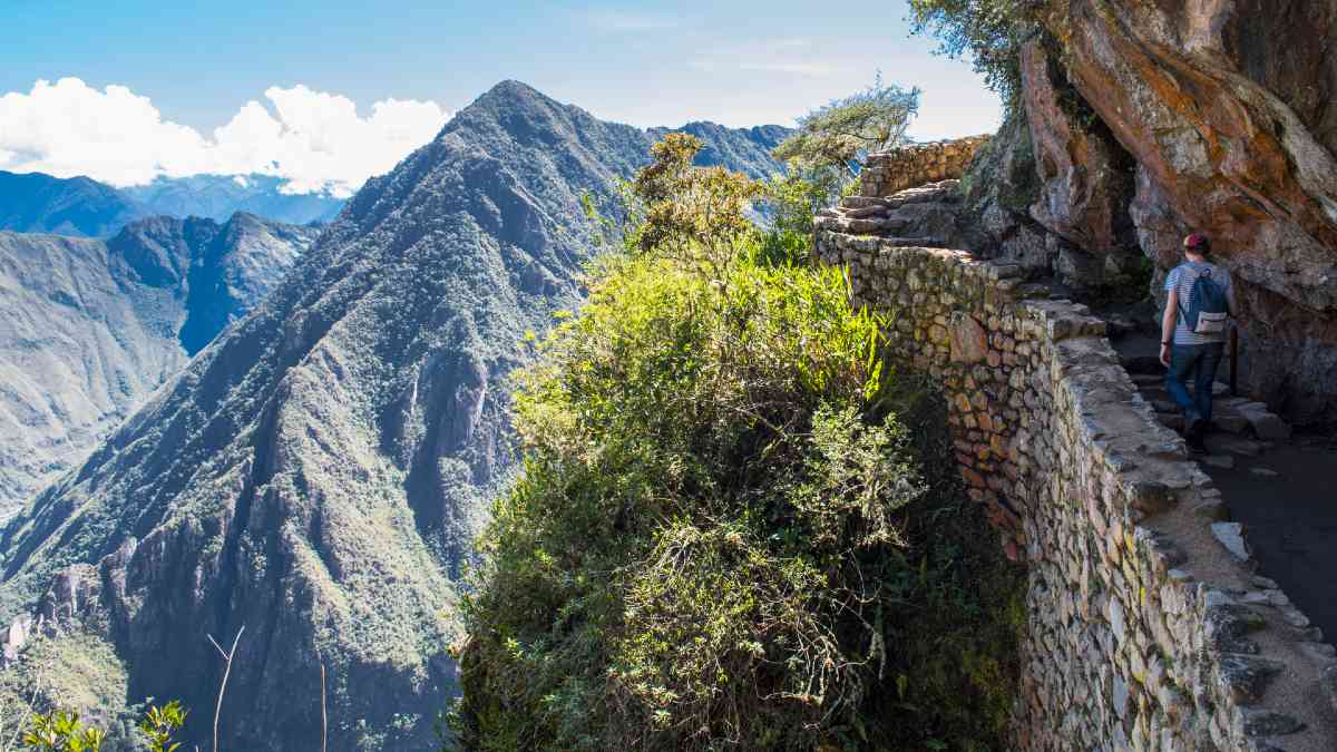 man ascending stone stairs on the Inca Trail