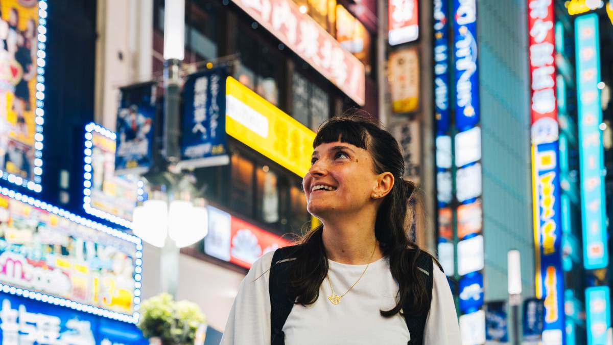 young woman smiling in Tokyo's Shinjuku district