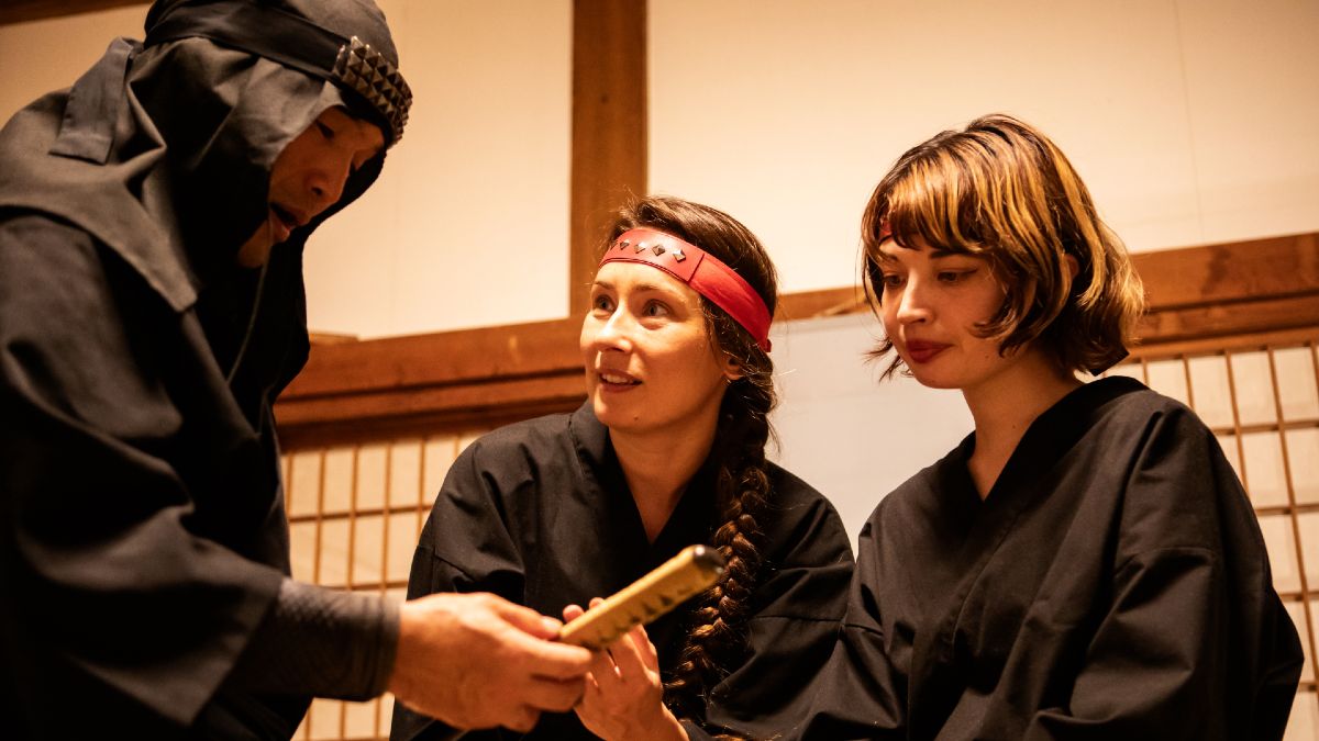 ninja experience; trainer allows two students to touch a blade handle
