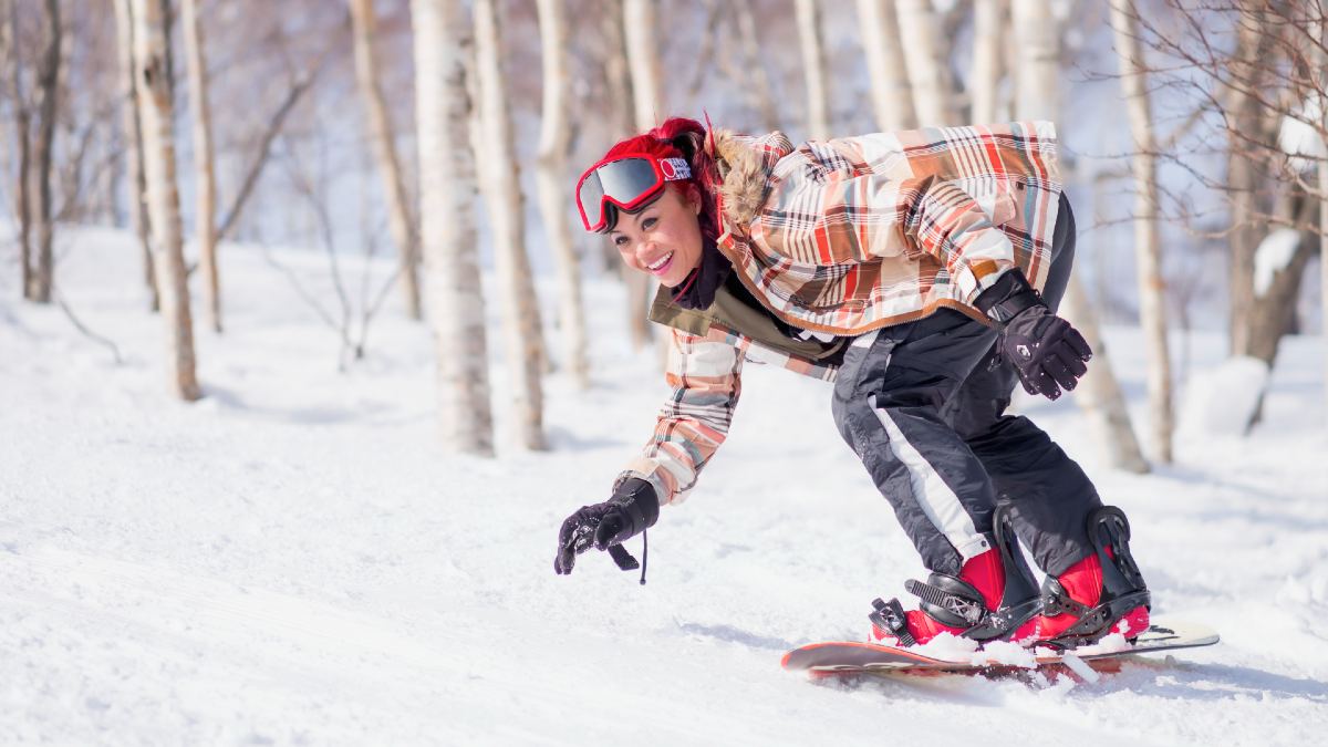 woman snowboarding in Japan