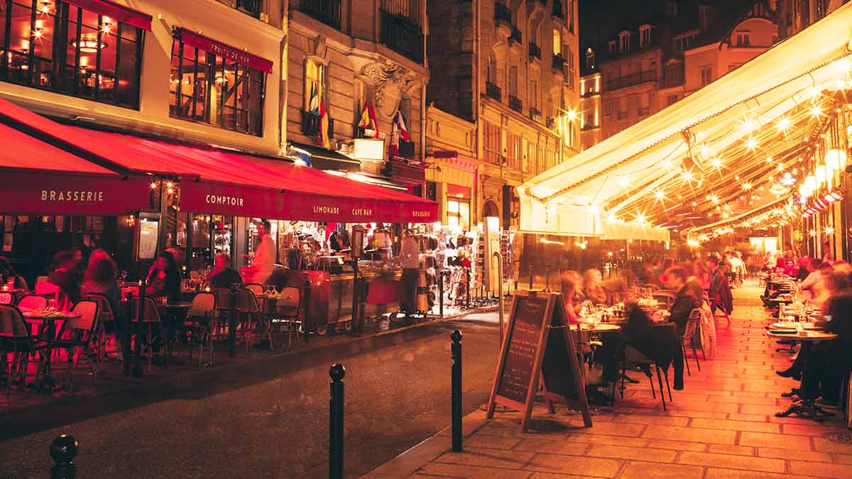 Latin Quarter cafes at night in Paris.