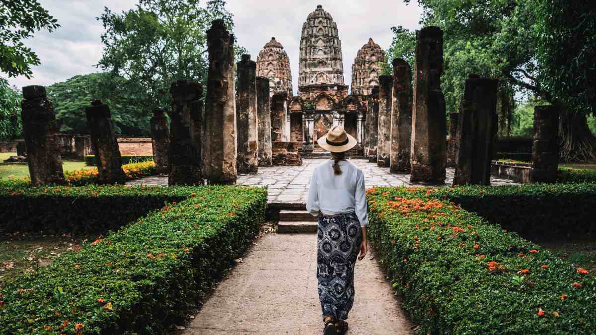woman walking into a temple