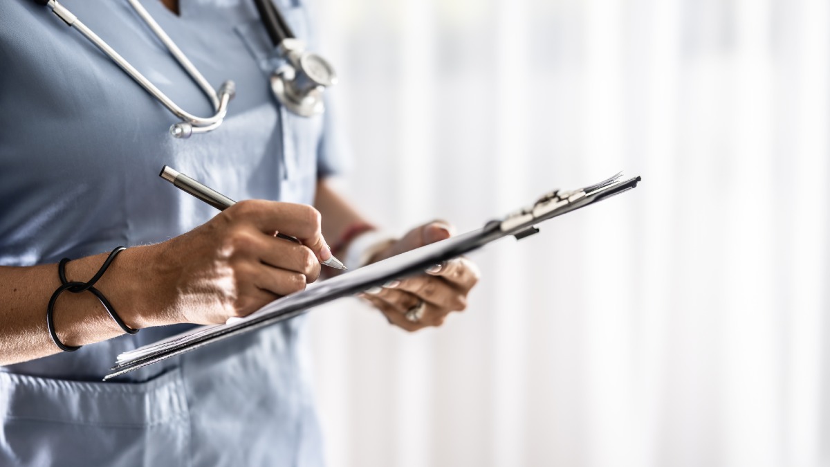 nurse filling out paperwork