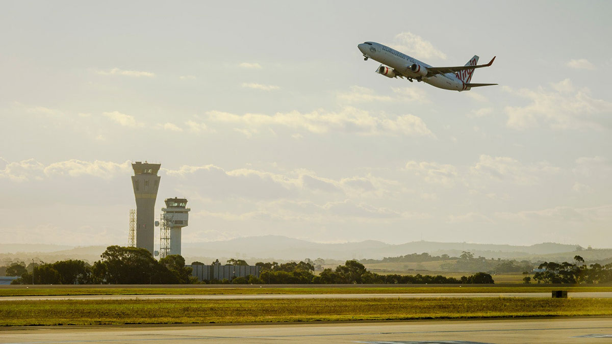 Plane flying above Melbourne Airport