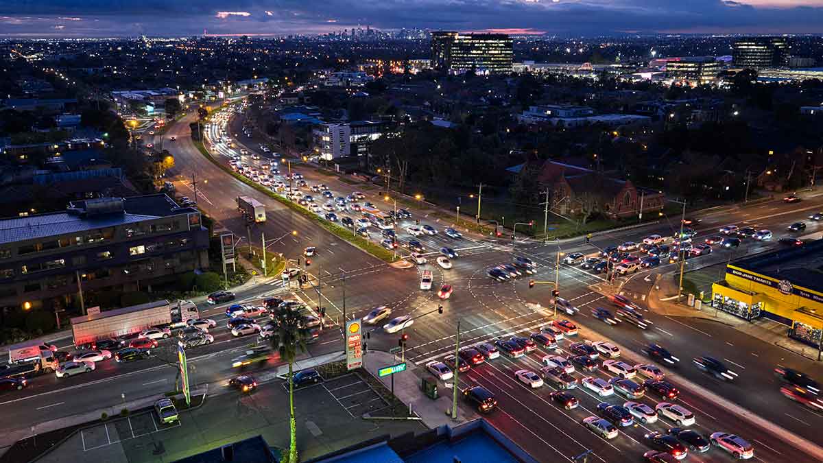 Aerial view of busy traffic at night on Princes Highway and Warrigal Road in Melbourne.