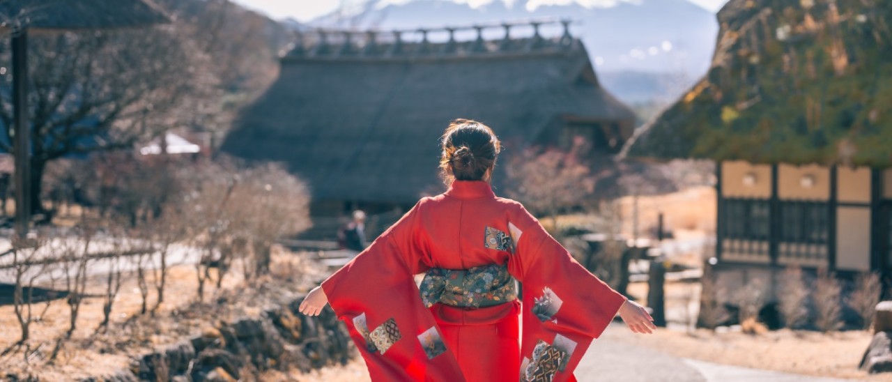 woman wearing kimono facing Mt Fuji