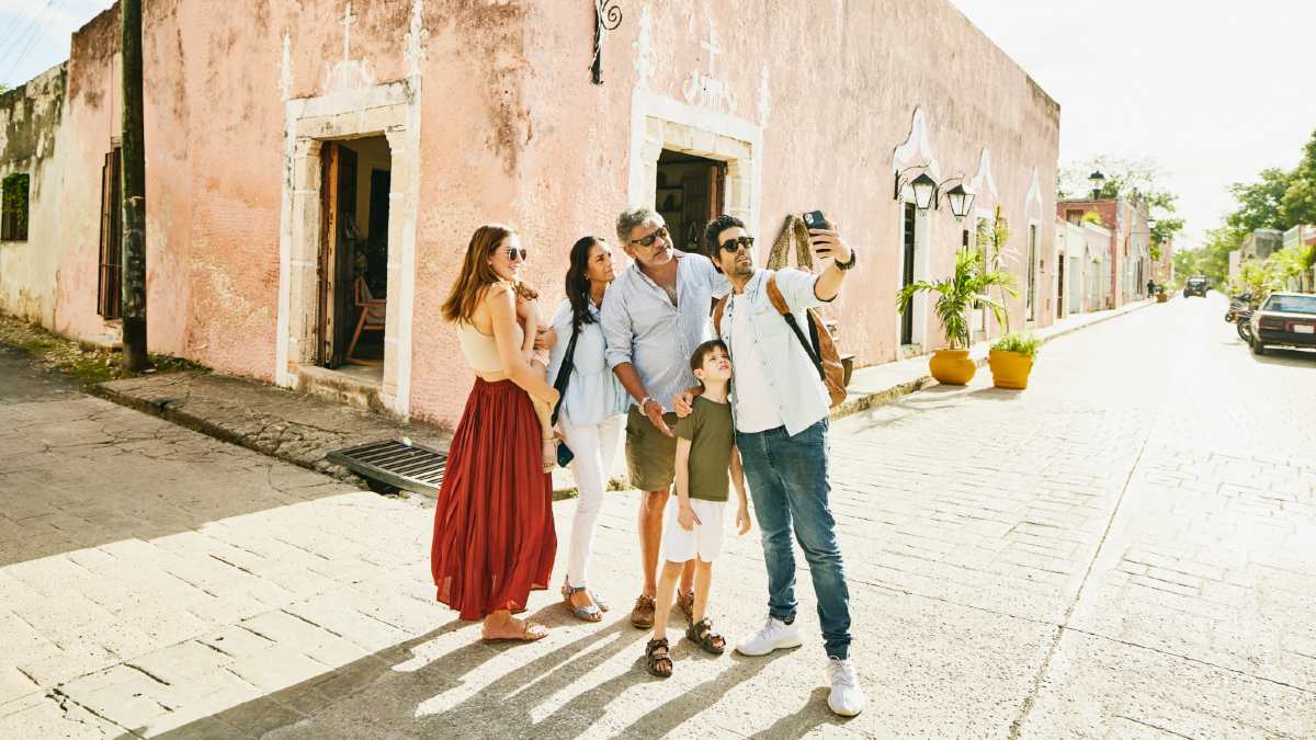 multi-generation family taking a photo on holiday