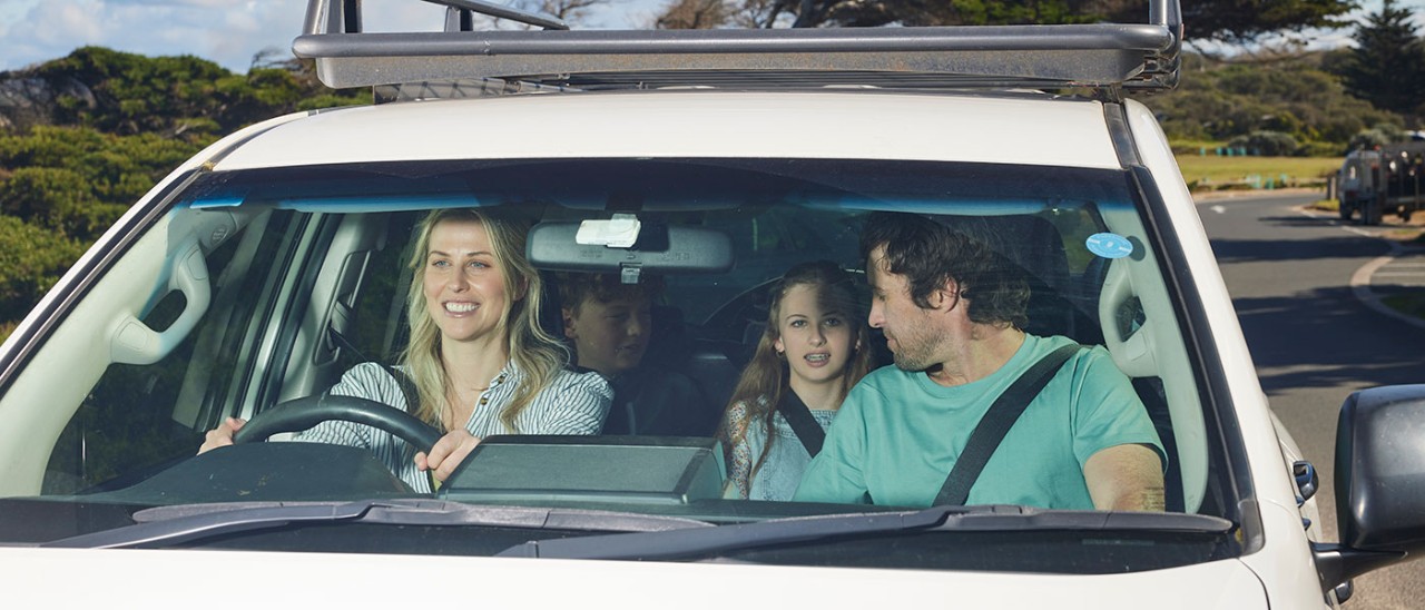 Family in car for road trip.