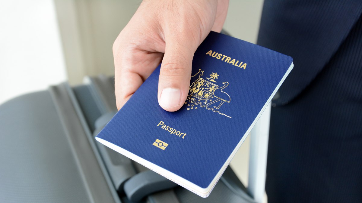 hand holding Australian passport