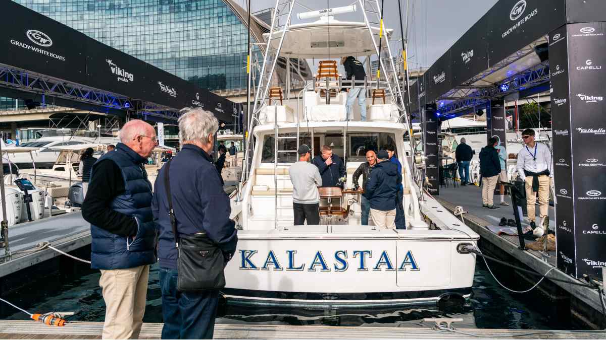 men looking at boats
