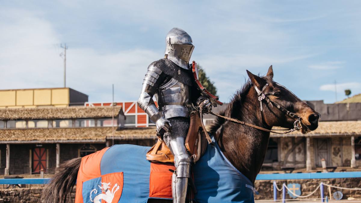 armoured knight riding a horse