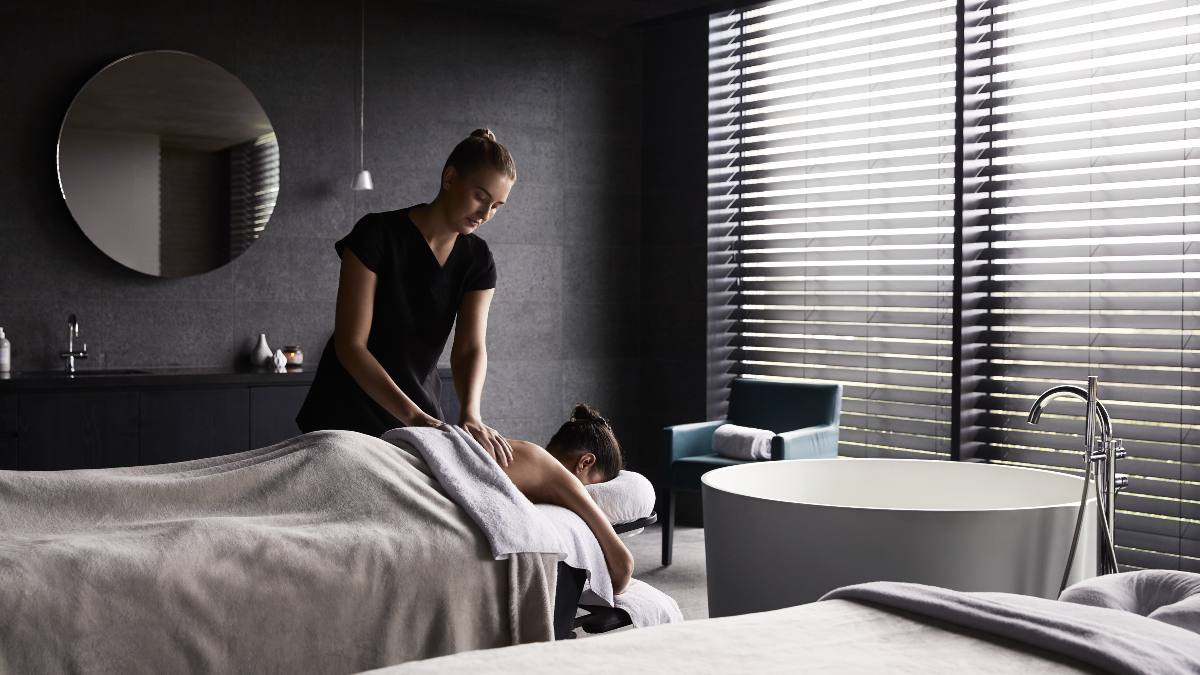 woman receiving massage at a spa
