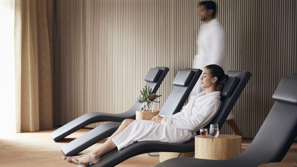 woman reclining in spa in bathrobe