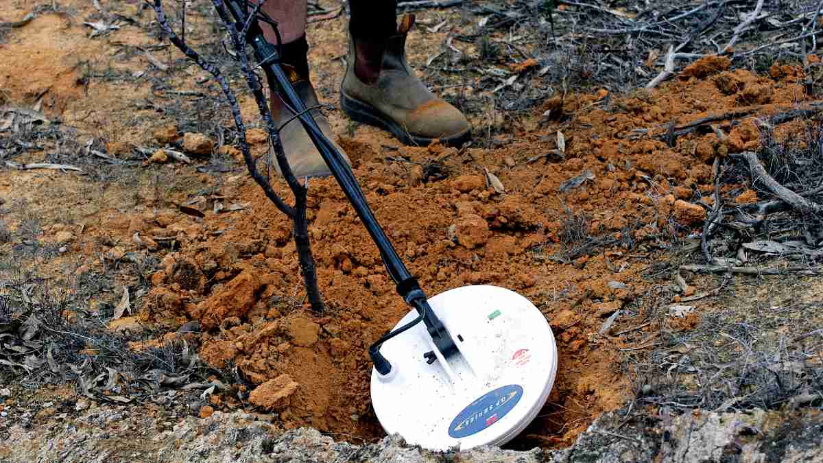 person using a metal detector