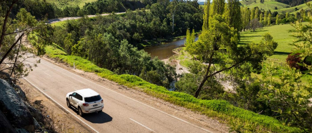Great Alpine Road_Visit Victoria white car driving along the Great Alpine Road