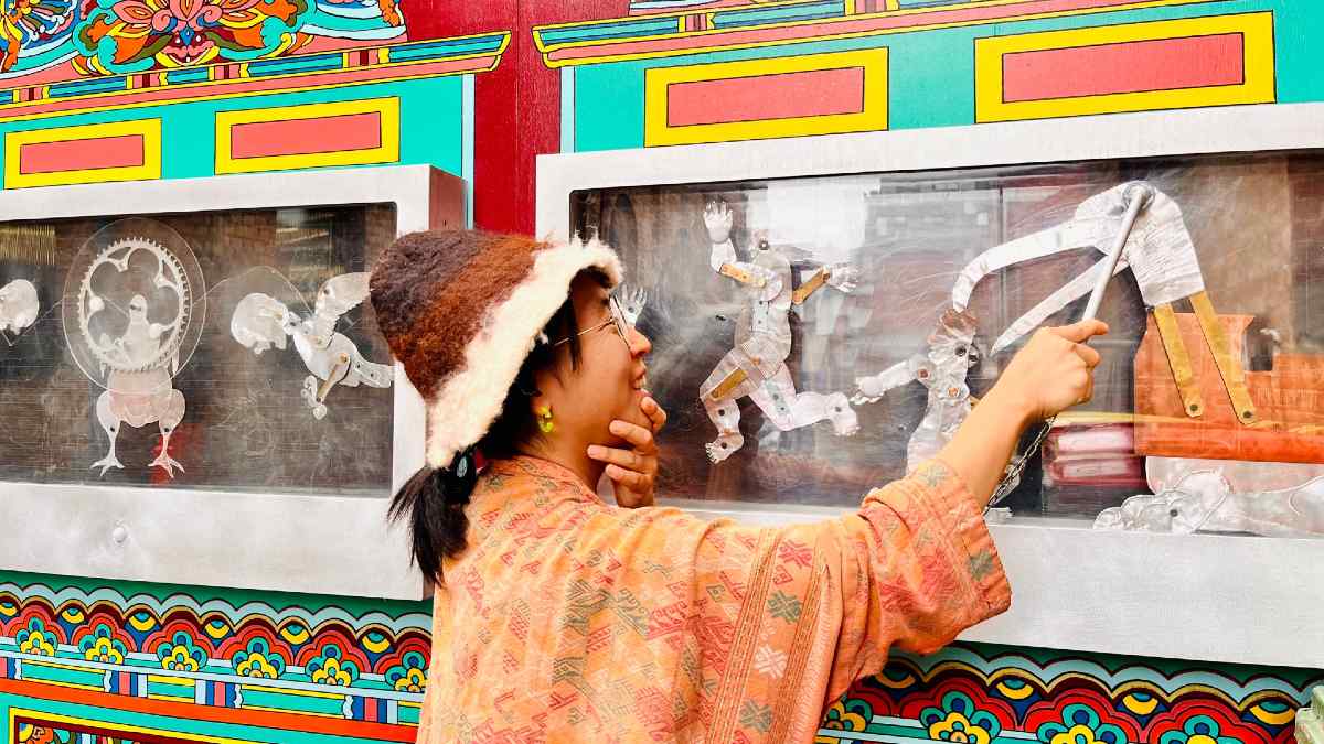 Artists UB plays with magnetic shadow puppets on a colourful outdoor installation