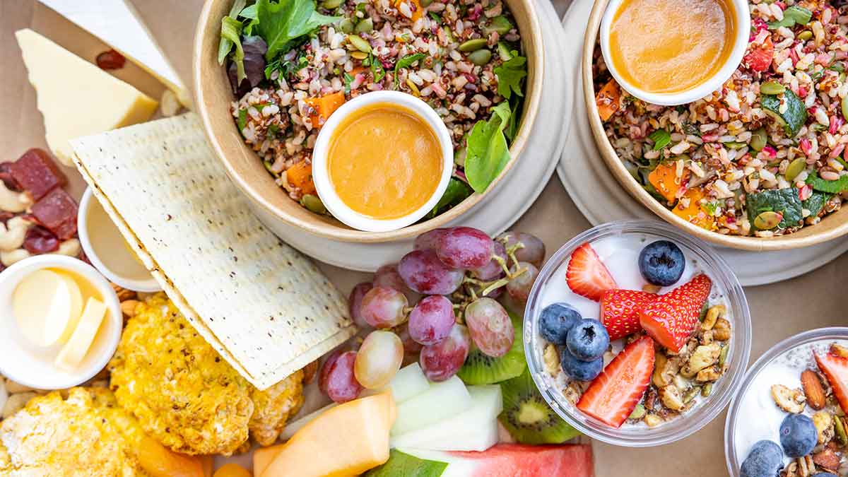 Overhead view of healthy salads and fruit that are on the menu at Peninsula Hot Springs.