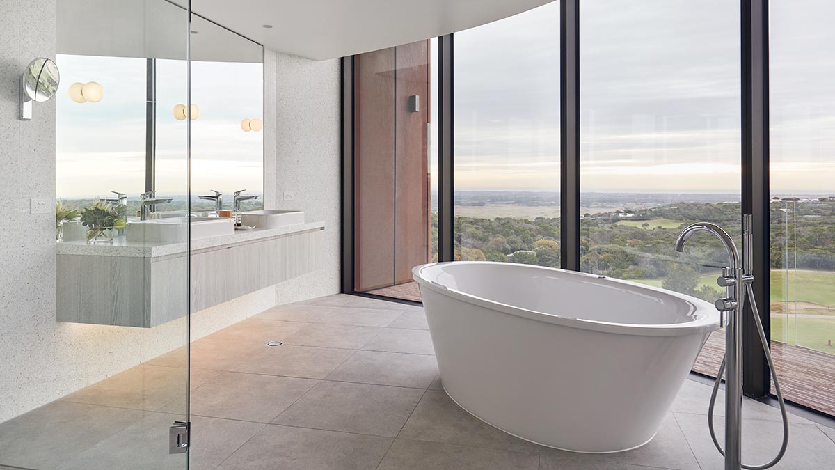 Spa suite featuring spa bath in large bathroom with spectacular view of national park and Mornington Peninsula coastline.